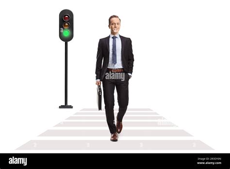 Full Length Portrait Of A Businessman Crossing Pedestrian At Green