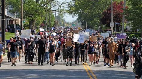 Protesters And Cleveland Officers Kneel Pray Together During George Floyd Demonstration At