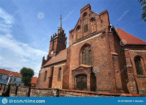 Historic Gothic Red Brick Church With A Belfry In The Village Of