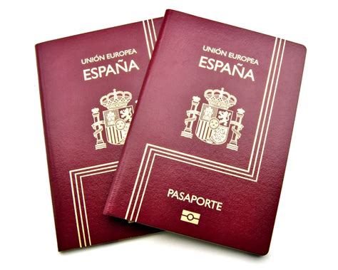 Two Passports From Spain In Red Surrounded By White Background משרד