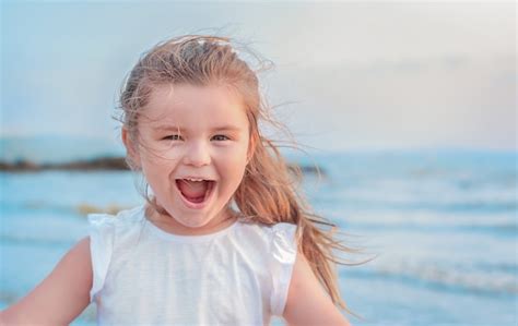 Premium Photo Portrait Of A Child At The Sea Girl Laughs