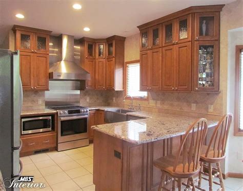 The color of the kitchen cabinets bring life to the area. modern light brown kitchen cabinets home decor color with ...
