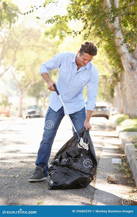 Man Picking Up Litter In Suburban Street Stock Image Image Of Picking