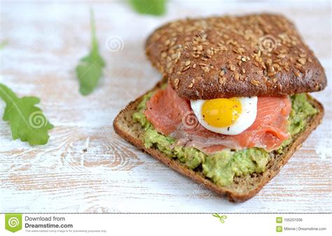 Smoked Salmon Sandwich With Avocado And Quail Egg Stock Photo Image