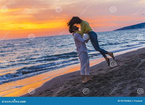 Happy Young Romantic Couple In Love Have Fun On Beautiful Beach At