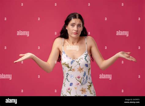 Beautiful Young Girl Spreads Her Arms On The Pink Background Stock