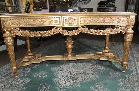 Wooden centre table designs with glass top are more sturdy than ones with metal as the wood brackets the glass making it more secure. Italian Gilt Renaissance Console Centre Table