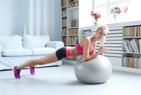 Free Photo Fitness Blonde Woman Doing Stretches With Her Exercise