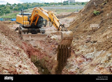 Excavator Digging A Trench For The Pipeline Excavation Stock Photo Alamy