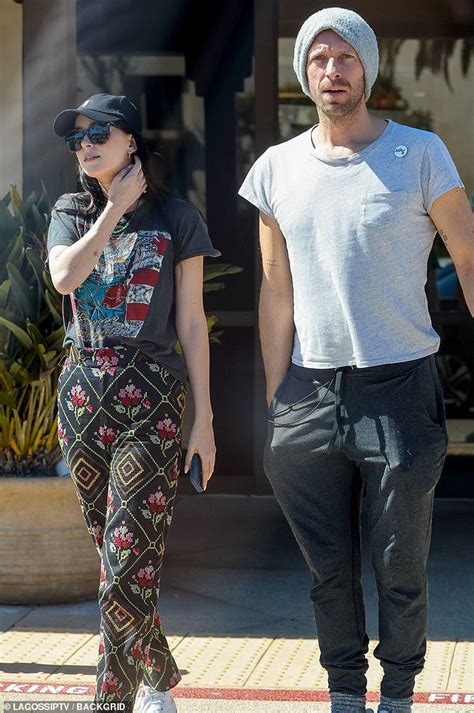 Dakota Johnson Locks Arms With Chris Martin During A Rare Public Outing In Malibu Daily Mail