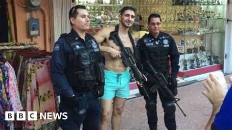 Mexicans Angry After Tourist Poses With Police Weapon Bbc News