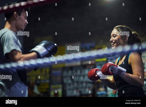 Male And Female Boxers Having Boxing Match In Ring Stock Photo Alamy