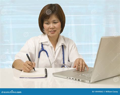 Nurse Sitting At Her Desk Stock Photo Image Of Attractive 14949062