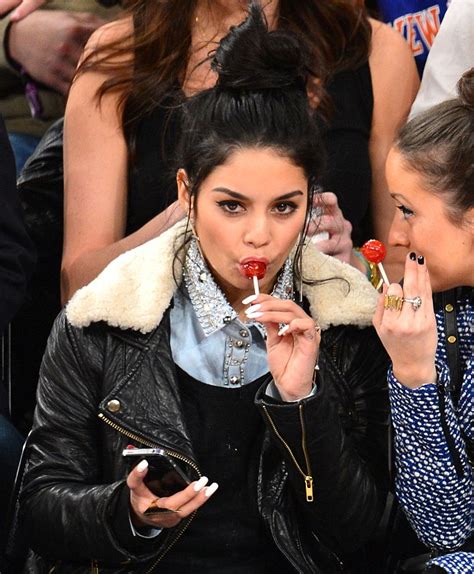 Vanessa Hudgens Sucks On A Lollipop As She Catches A Basketball Game