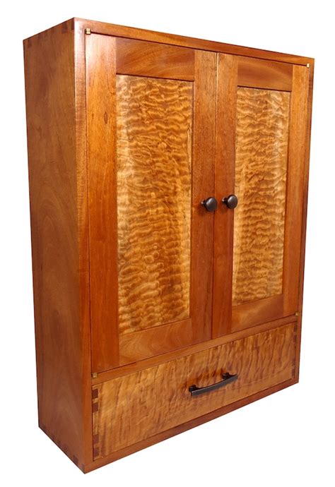 Free up space in crowded kitchen cabinets and pantries by hanging over cabinet doors; The Wall-Hanging Cabinet - The Wood Whisperer