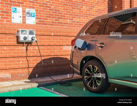 Mitsubishi Outlander Phev Plugged In And Charging At An Ev Driver Ev