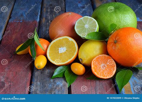 Set Of Citrus On Wooden Background Orange Mandarin Lemon Grapefruit