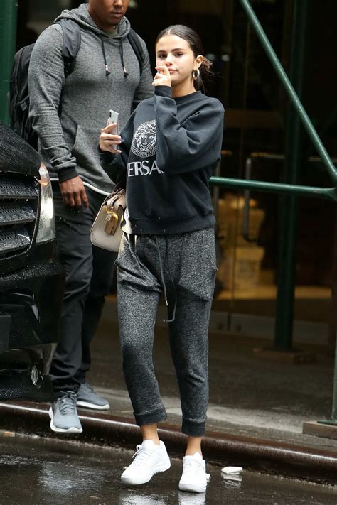 Selena Gomez Wears A Grey Versace Sweatshirt With Matching Sweatpants