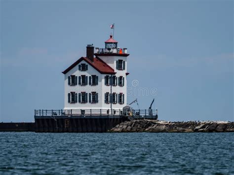 Lighthouse At Lake Erie On The Ohio Coast Looking Over Rough Water Usa