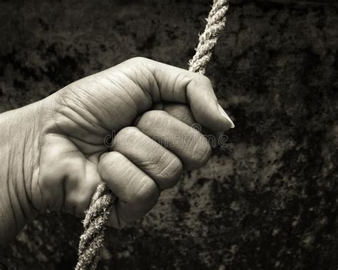 Black And White Photo Of A Hand Holding A Rope Royalty Images Stock