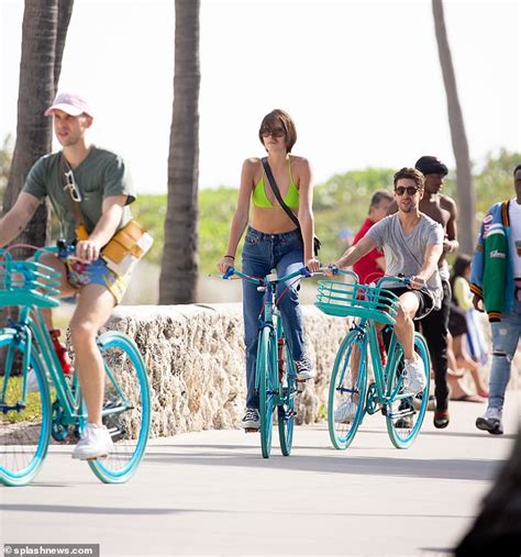 Kaia Gerber Wears Lime Bikini Top While Biking In Miami With Pals