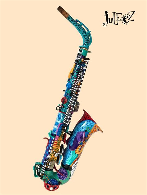 a colorfully decorated saxophone is hanging from the side of it s head and neck