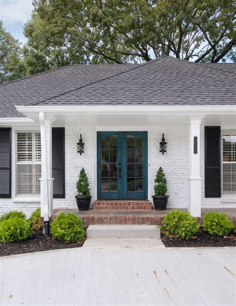As we've mentioned several times before, it's important to create a beautiful appearance for your house so your guests can feel welcomed. White brick exterior with black shutters and double door ...