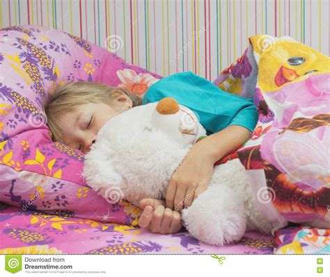 Beautiful Little Girl With A Toy Polar Bear Stock Photo