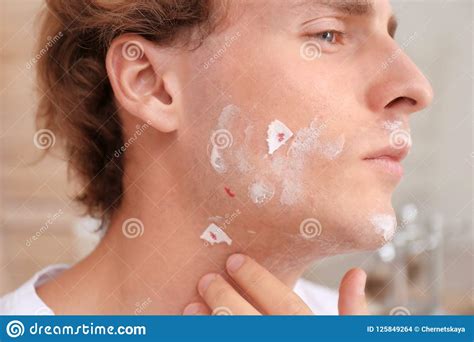 Young Man With Face Hurt While Shaving Stock Photo Image Of