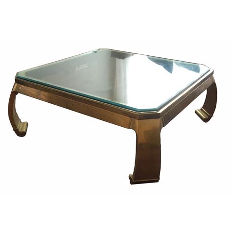 If you want it to be more practical then we have them in stock; Vintage Brass Glass Top Coffee Table | Chairish