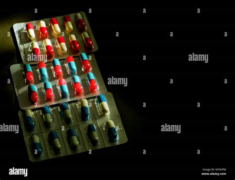 Colorful Of Antibiotic Capsule Pills In Blister Pack On Dark Background