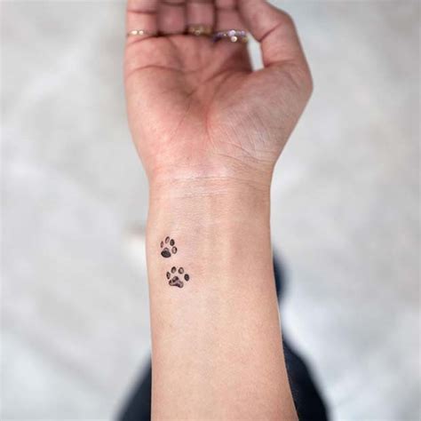 Top 30 paw print tattoos amazing paw print tattoo designs 2019 Paw Print Tattoos On Wrist