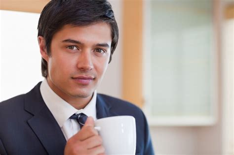 Premium Photo Close Up Of A Handsome Businessman Drinking Coffee