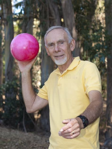 Senior Man Throwing Large Ball Stock Image Image Of Recreation Throwing 10356093