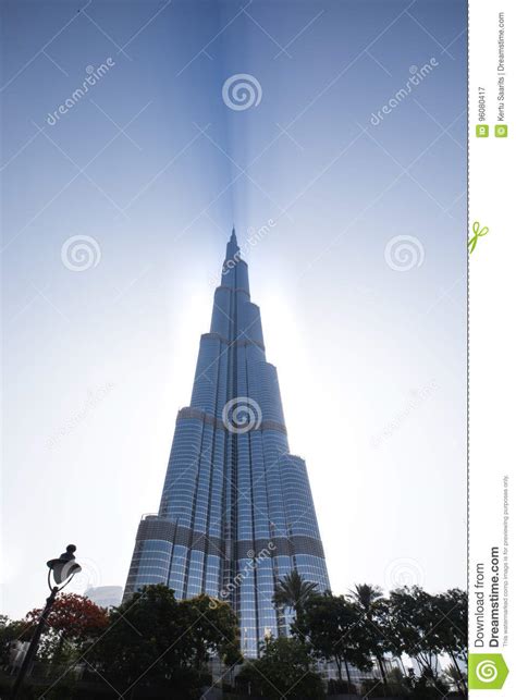 Burj Khalifa Casting A Shadow Through Clouds During A Sunrise