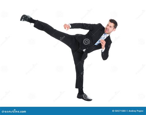 Businessman Kicking Over White Background Stock Photo Image Of