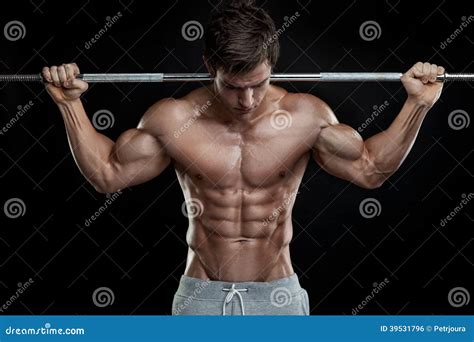 Muscular Bodybuilder Flexing Biceps Stock Photo