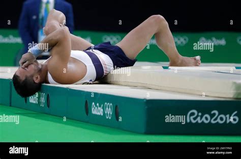 france s samir ait said holds his leg after injuring it while performing on the vault during the