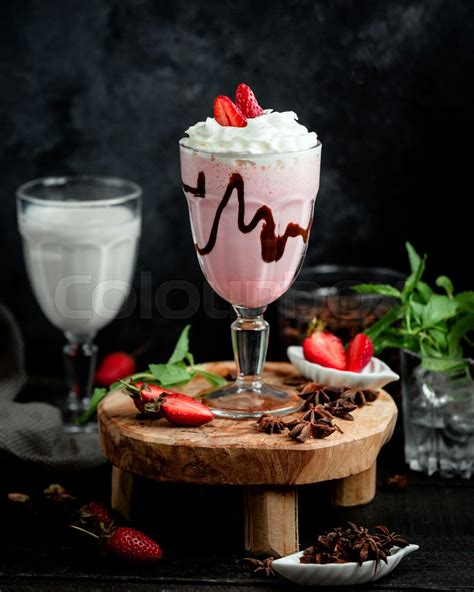 A Glass Of Strawberry Milkshake Topped With Whipped Cream And Strawberry Stock Image Colourbox
