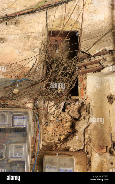 Electrical Cables And Telecommunications Wires Tangled And Hanging Down