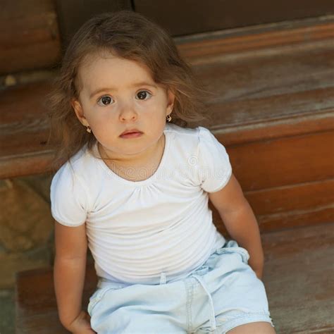 Girl Sitting On The Steps Of The Porch Stock Photo Image Of Child