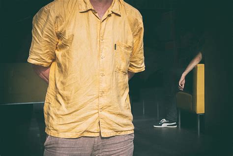 Royalty Free Photo Cropped Image Of A Man Dressed In A Yellow Shirt