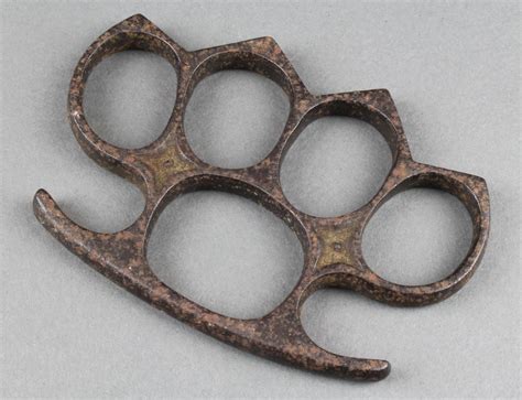 Lot 201 A Victorian Iron Knuckle Duster 4 Est £50 100 Swords And