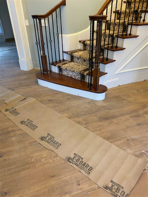 Subtract the thickness of your laminate flooring from the depth dimension, if you are planning to cover risers remove the boards and apply a coat of laminate flooring adhesive to the back of each piece with a notch edged trowel. new floors don't match stairs