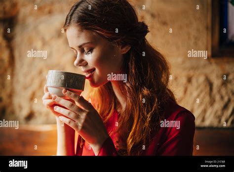 Caucasian Woman Sipping Cup Of Tea Stock Photo Alamy