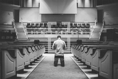 Man Kneeling In The Aisle Of A Church In Front — Photo — Lightstock