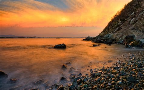 Sea Water And Rocks At Golden Hour Hd Wallpaper Wallpaper Flare
