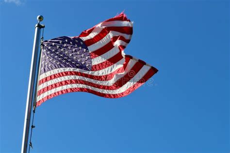 American Flag Flying From Flagpole Stock Photo Image Of Justice