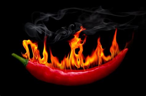 Premium Photo On Fire Red Chili Pepper At Black Background