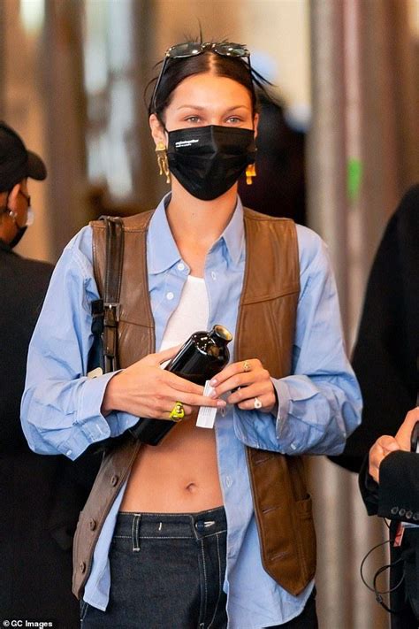 Bella Hadid Flashes Her Svelte Abs In Sports Bra And Unbuttoned Shirt